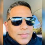 man wearing sunglasses inside a car